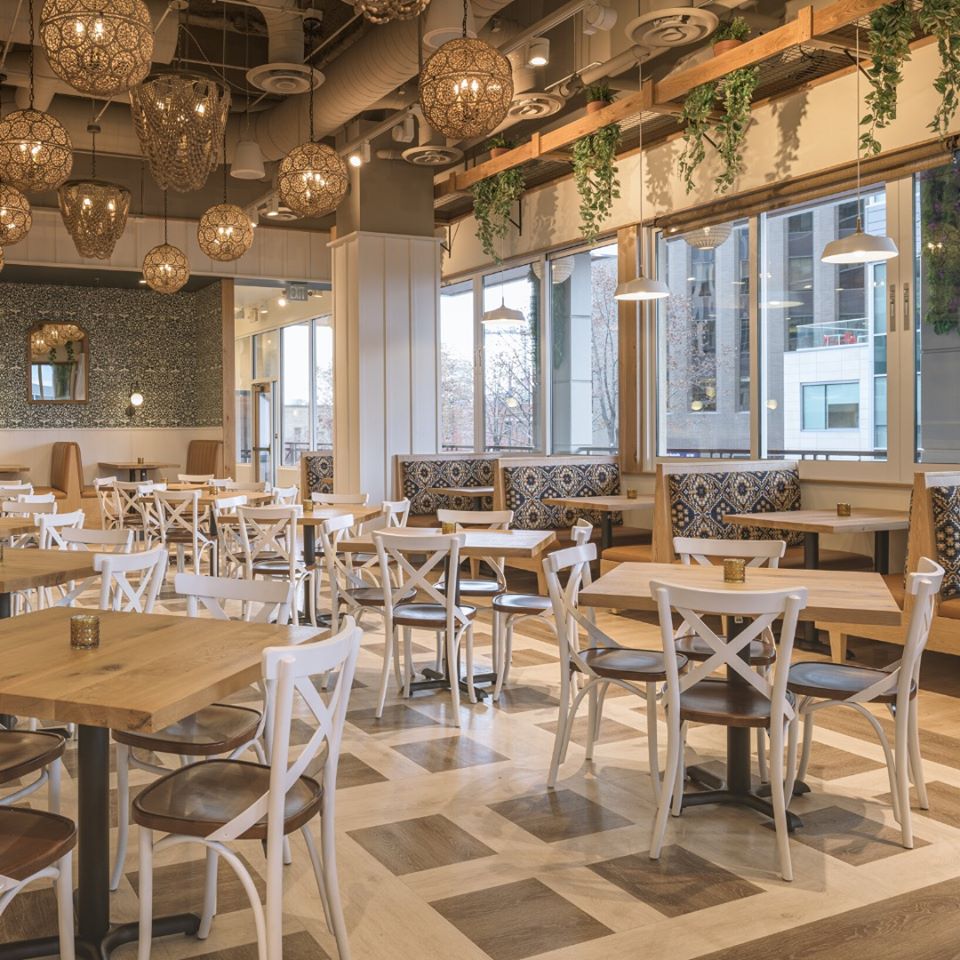 Asheville-NC-earthy-restaurant-interior-with-custom-built-white-chairs-with-wooden-tables