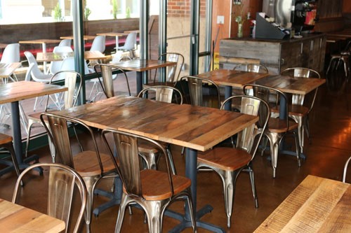Gastonia-NC-detailed-view-of-interior-of-restaurant-custom-built-wood-table-with-chairs