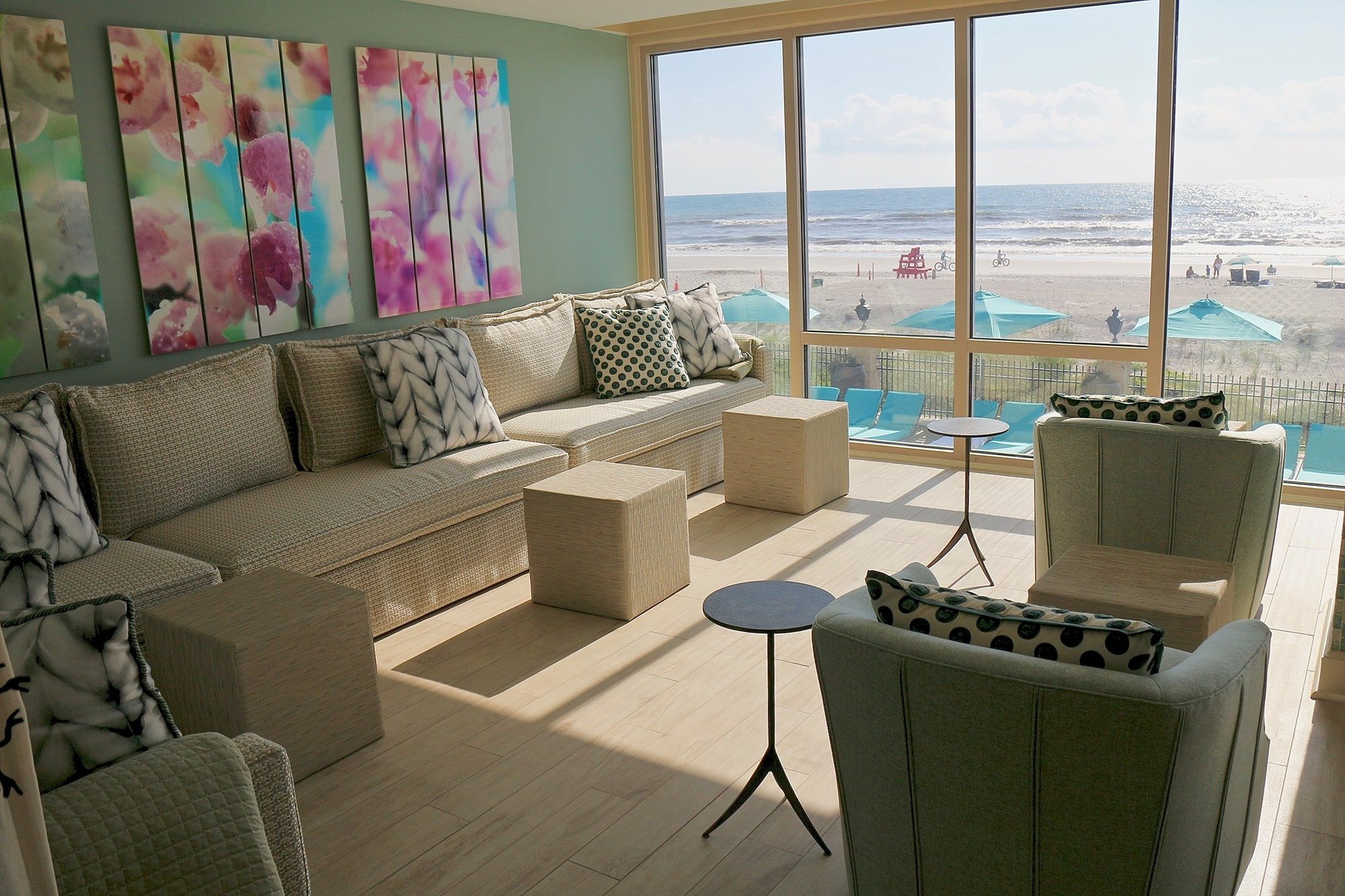 Jacksonville-FL-hotel-lounge-with-large-windows-viewing-ocean-with-large-cream-sofa