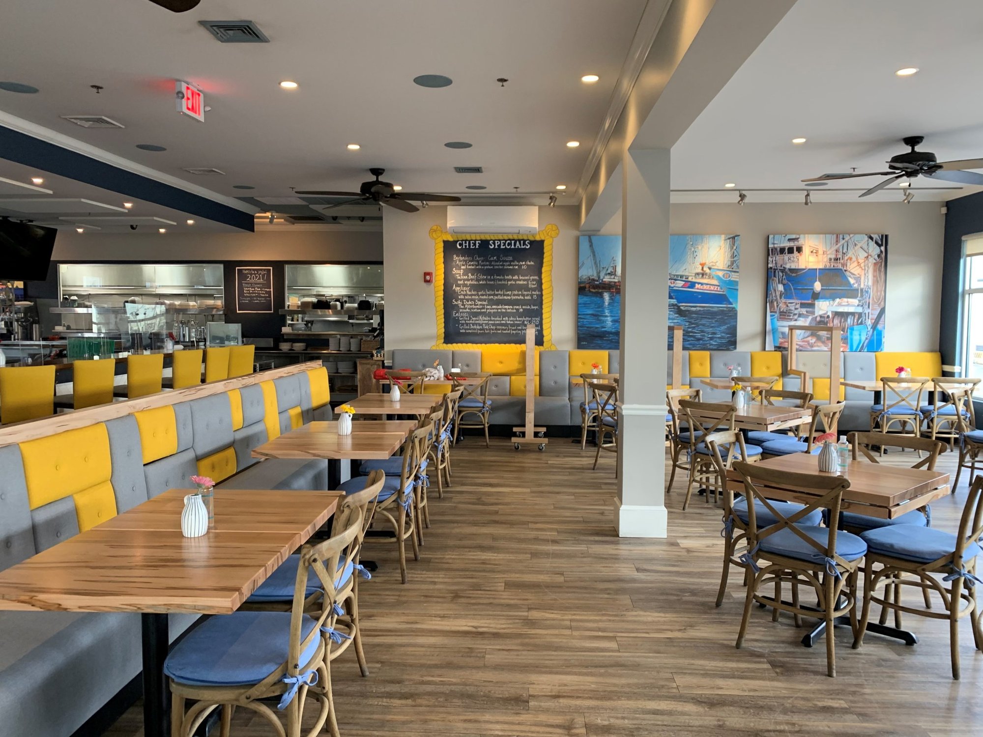 New-Bedford-MA-simple-modern-restaurant-interior-with-yellow-and-gray-booths-and-seating