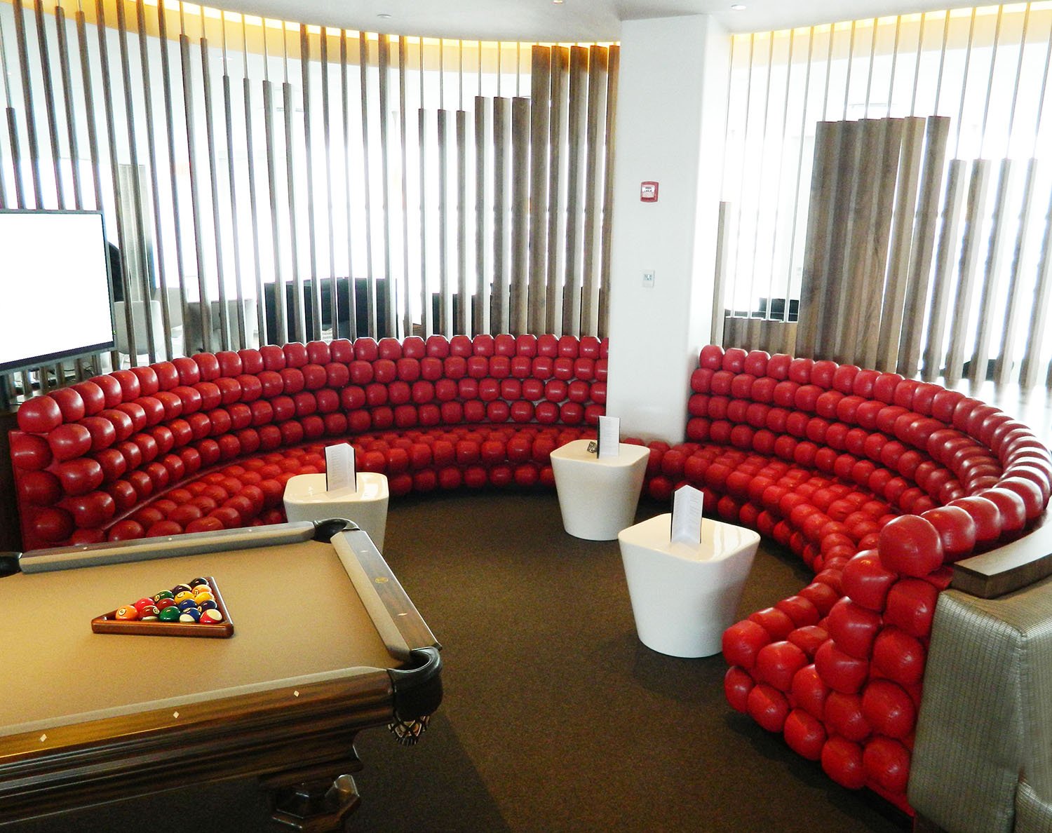 Queens-NY-modern-abstract-red-curved-custom-built-booth-with-a-pool-table