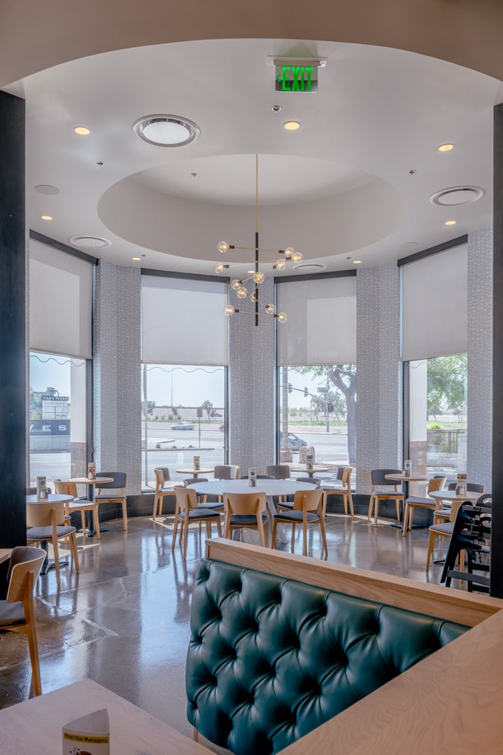Peoria-AZ-simple-modern-restaurant-dining-area-with-blue-tufted-booths