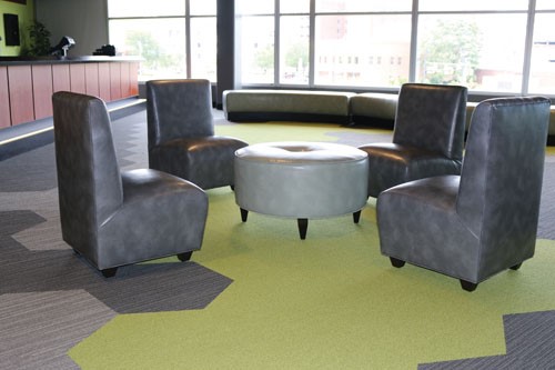 Youngstown-OH-aerial-view-of-corporate-lounge-area-with-four-leather-chairs-centered-around-leather-table